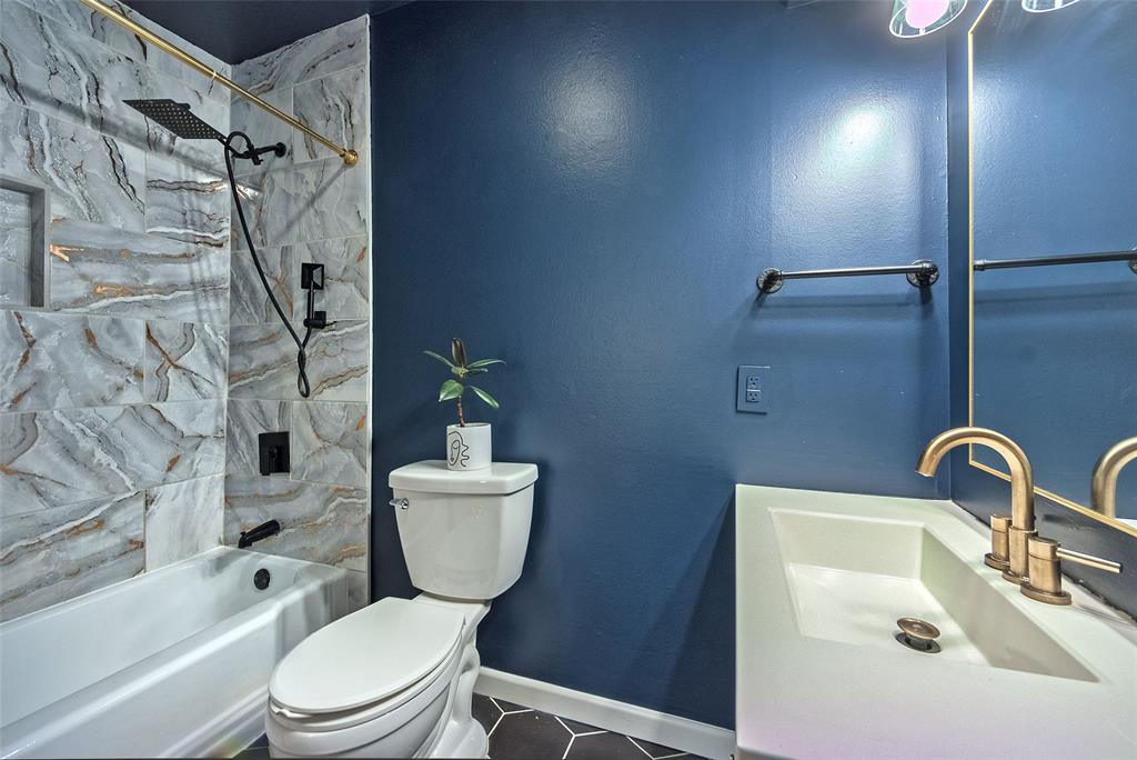 5220 Darlene Street Dallas, TX 75232 - Photo 13 of 16 a bathroom with a toilet sink and shower