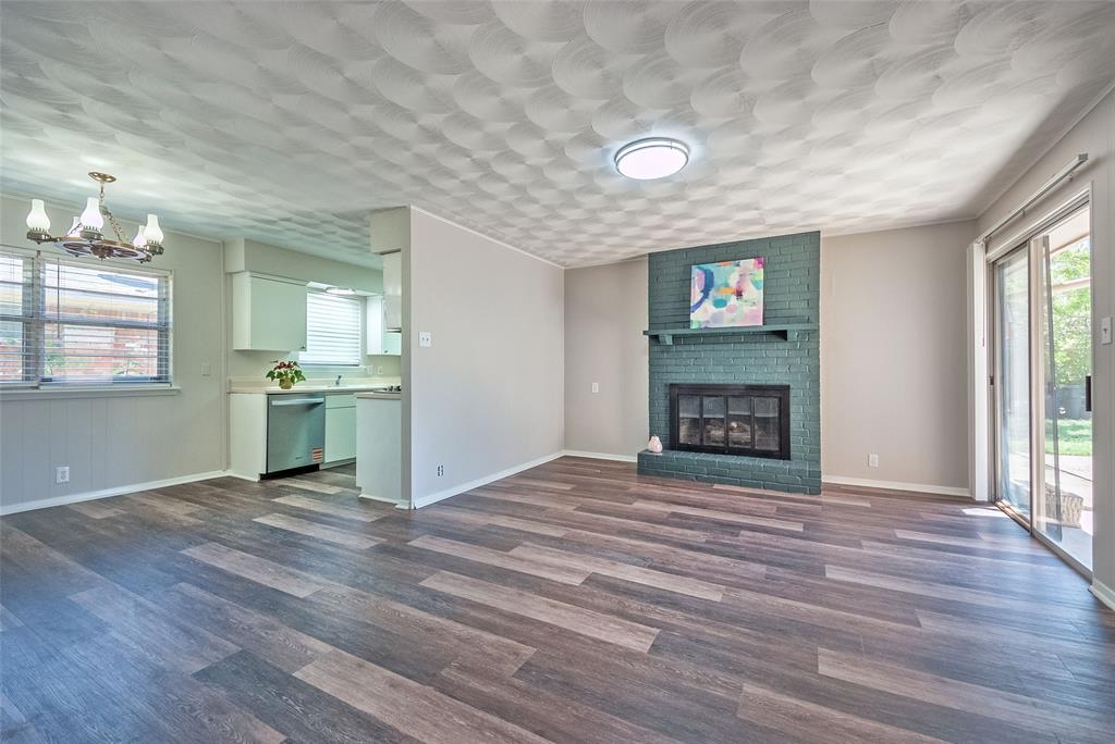 5220 Darlene Street Dallas, TX 75232 - Photo 2 of 16 a view of an empty room with window and fire place