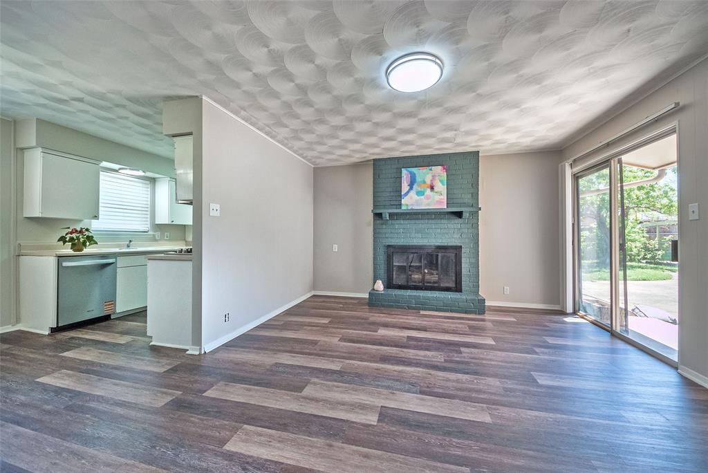 5220 Darlene Street Dallas, TX 75232 - Photo 3 of 16 a view of kitchen with granite countertop window and a fireplace