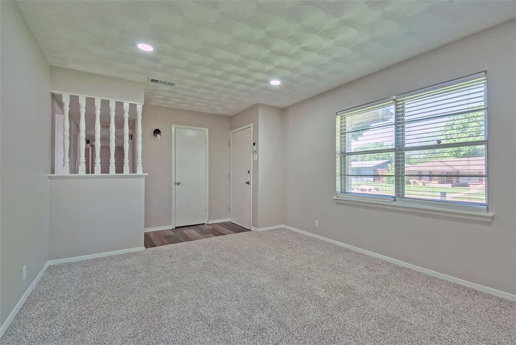 5220 Darlene Street Dallas, TX 75232 - Photo 4 of 16 a view of an empty room with a window