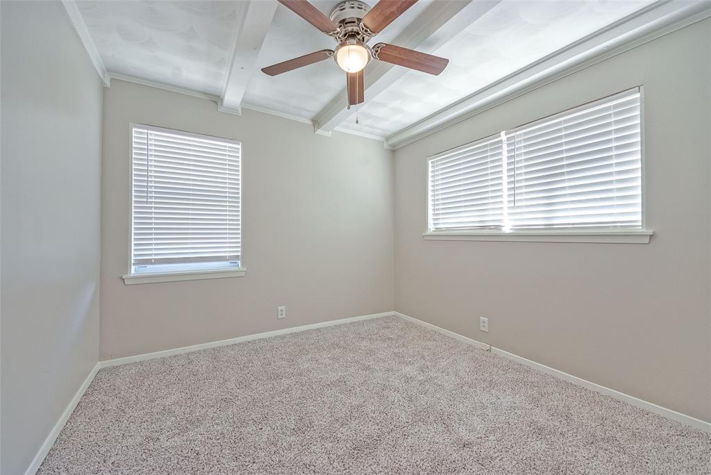 5220 Darlene Street Dallas, TX 75232 - Photo 9 of 16 an empty room with a window and a fan