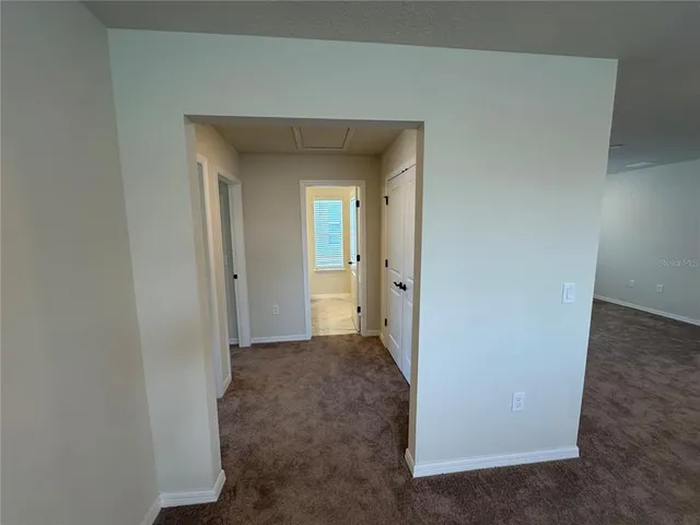 a bathroom with a granite countertop sink toilet and shower curtains