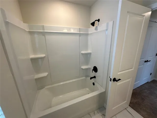 a view of storage and utility room with a sink