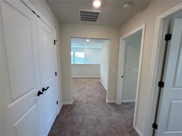 a view of storage and utility room with washer and dryer