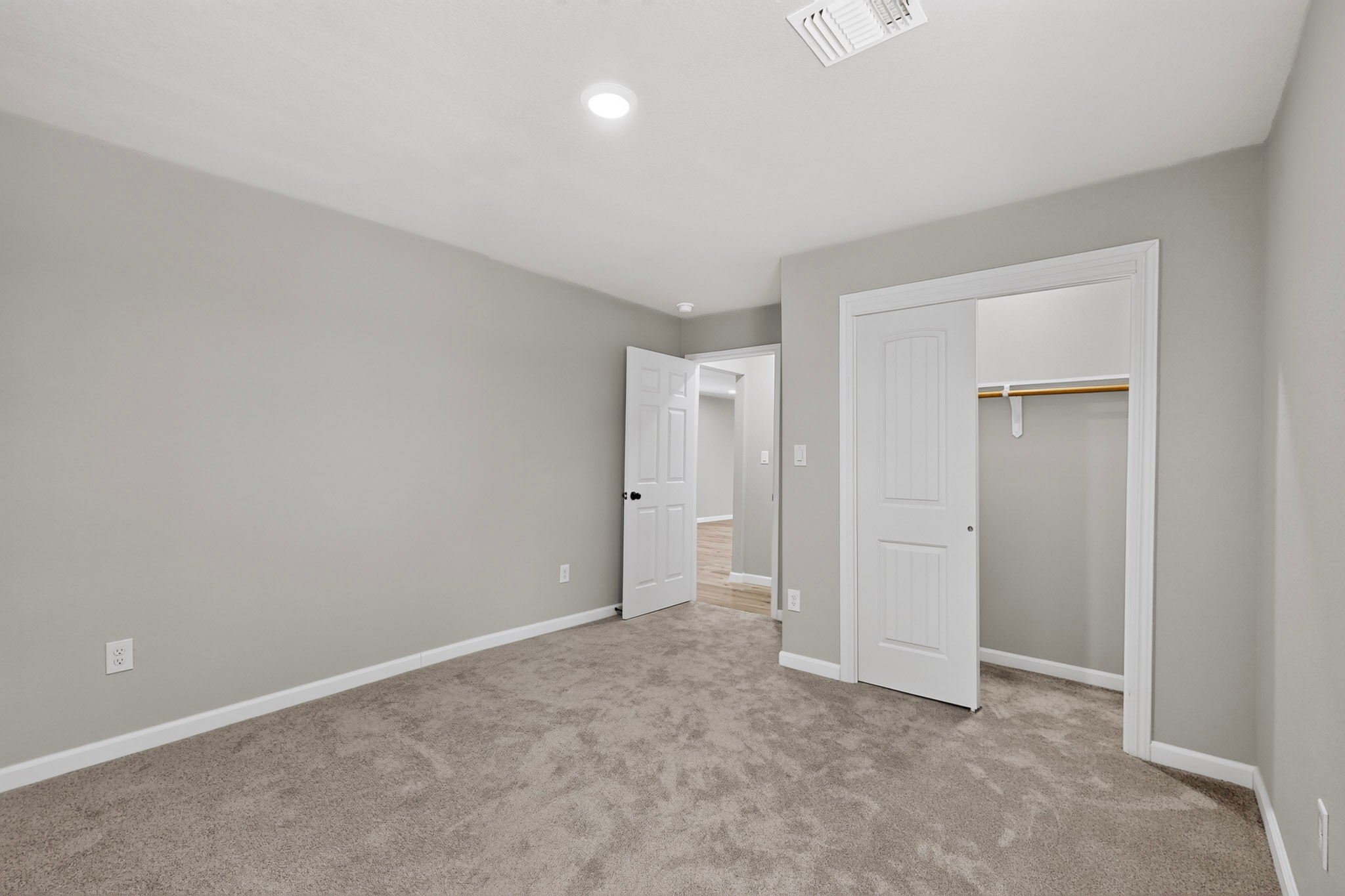 158 Fealy Road Red Rock, TX 78662 - Photo 29 of 40 Plush carpeting and an integrated closet system define this quiet secondary bedroom.