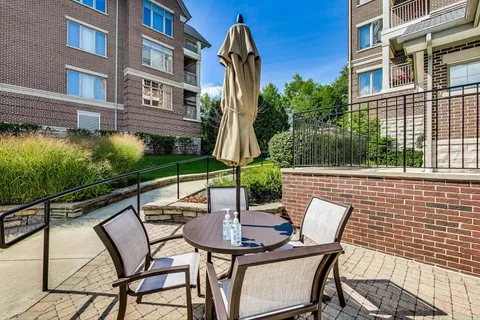 a view of a backyard with sitting area