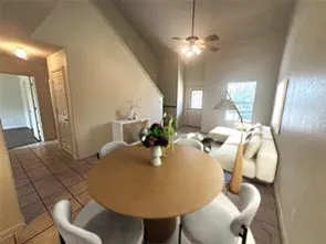 a dining room with furniture and chandelier