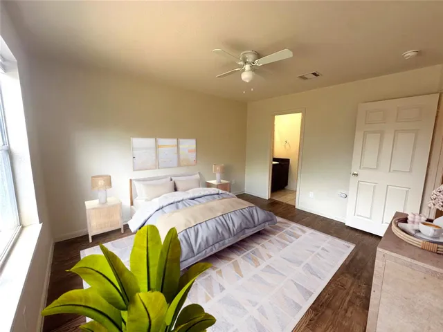 a bedroom with a bed window and walk in closet
