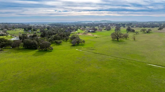 a view of a lake with a yard