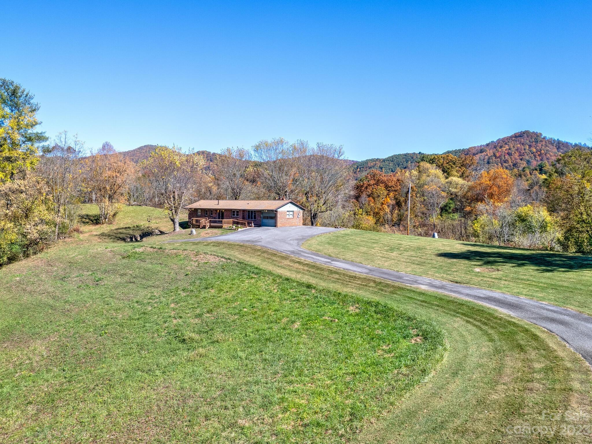 a view of a grassy area with an ocean