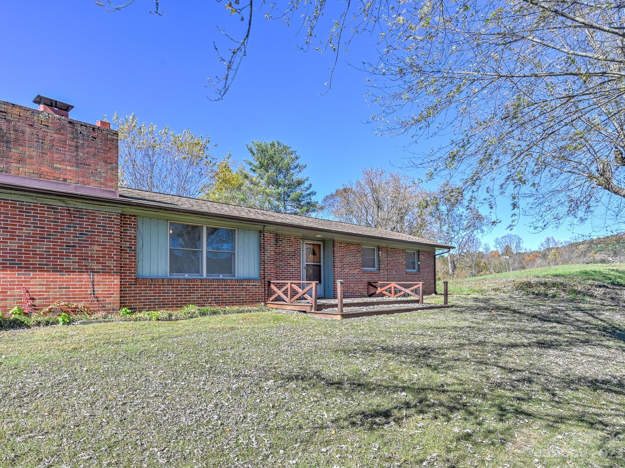 146 Old Road Marshall, NC 28753 - Photo 2 of 31 a front view of house with yard and seating space