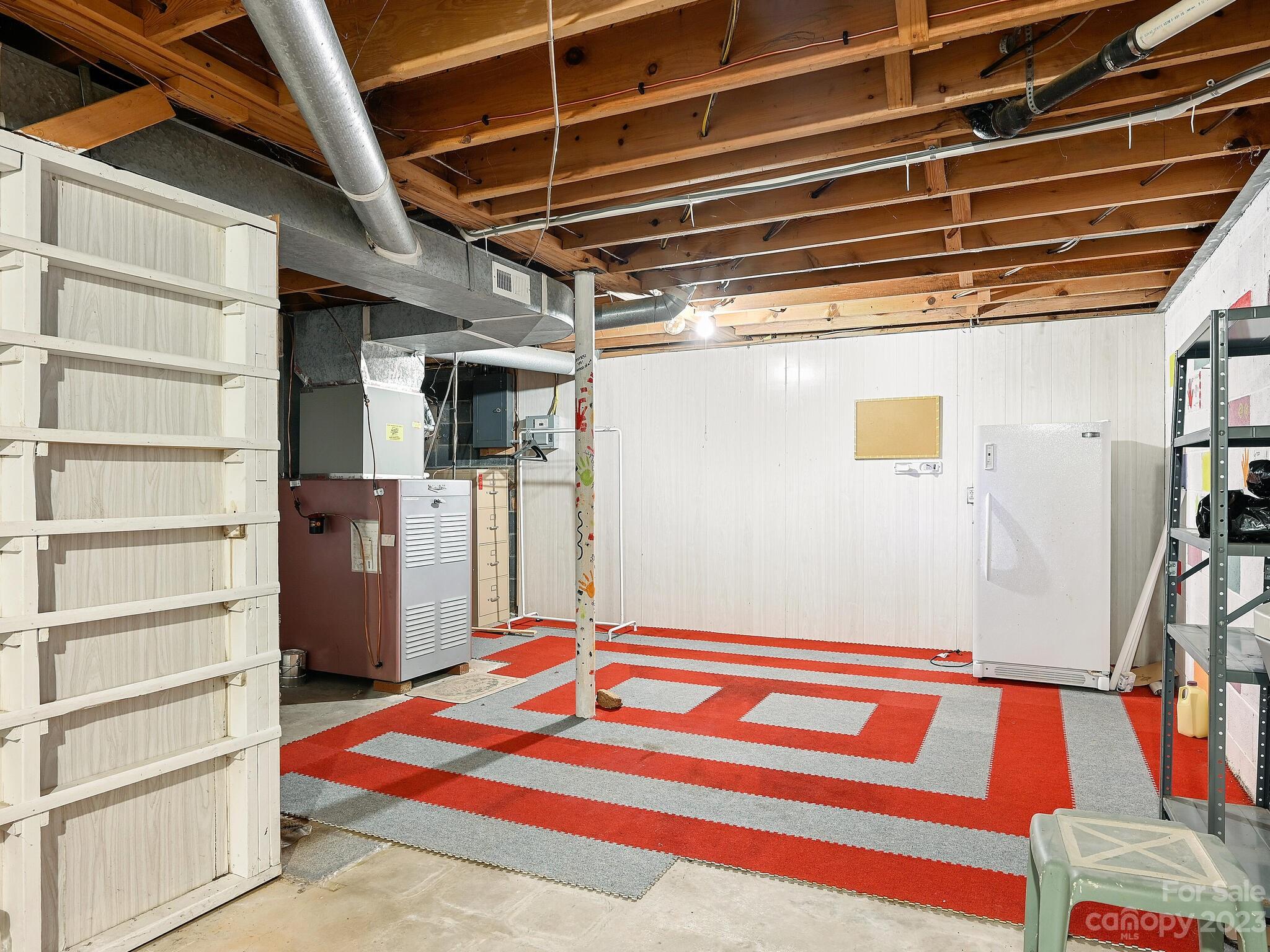 146 Old Road Marshall, NC 28753 - Photo 22 of 31 a utility room with closet and wooden floor