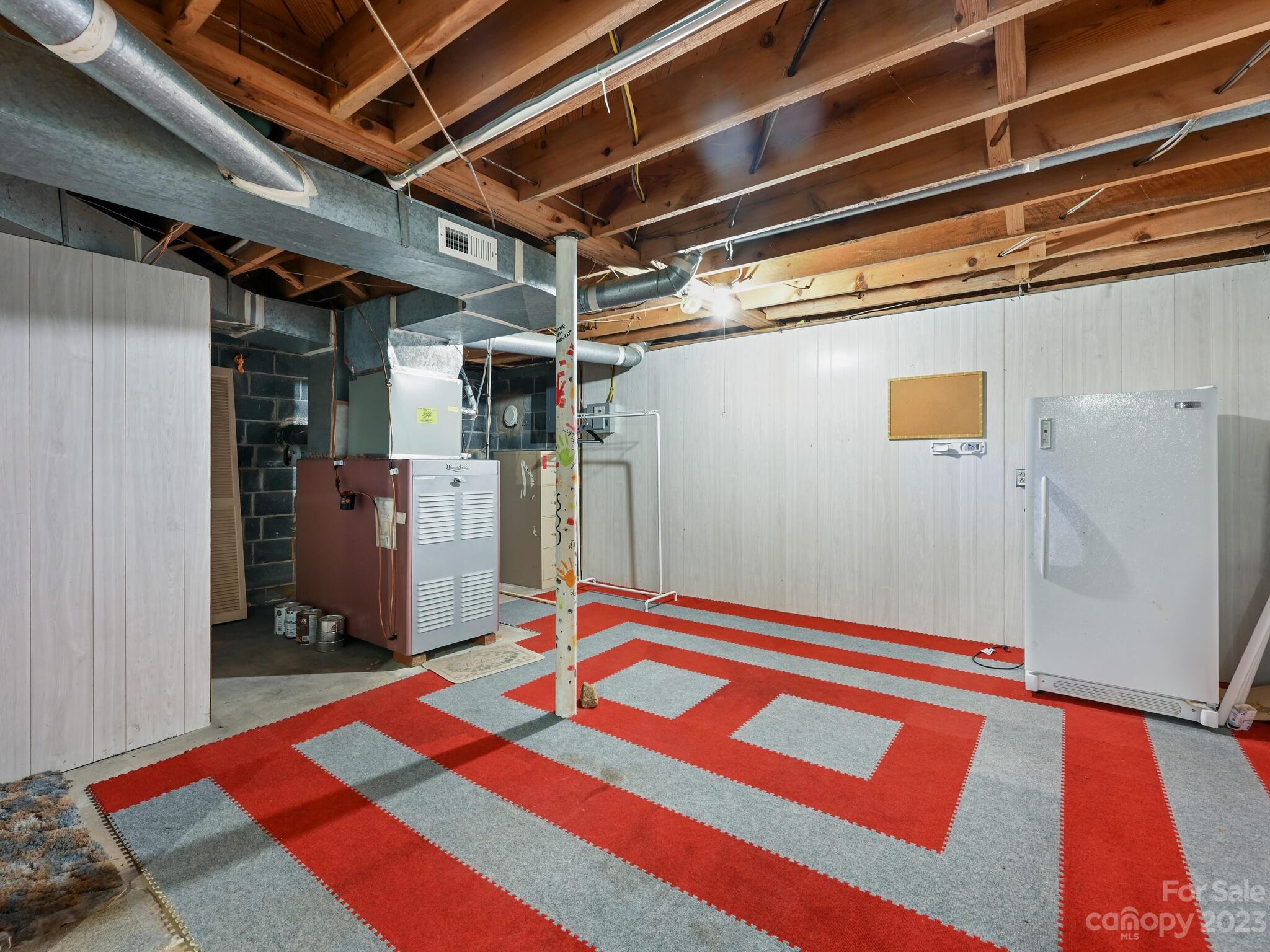 146 Old Road Marshall, NC 28753 - Photo 23 of 31 a bedroom with a bed and a mirror