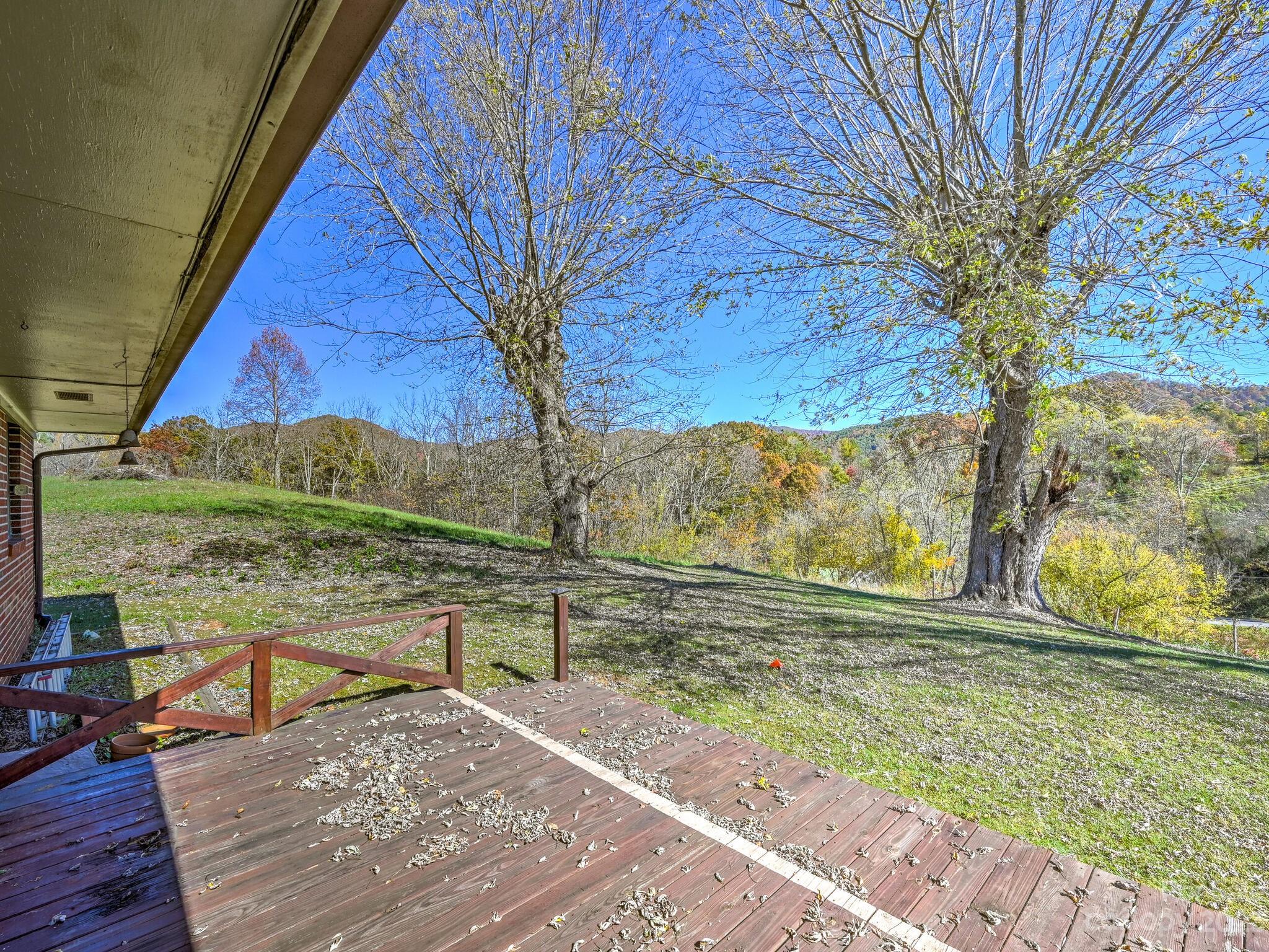 146 Old Road Marshall, NC 28753 - Photo 30 of 31 a view of a lake with a mountain