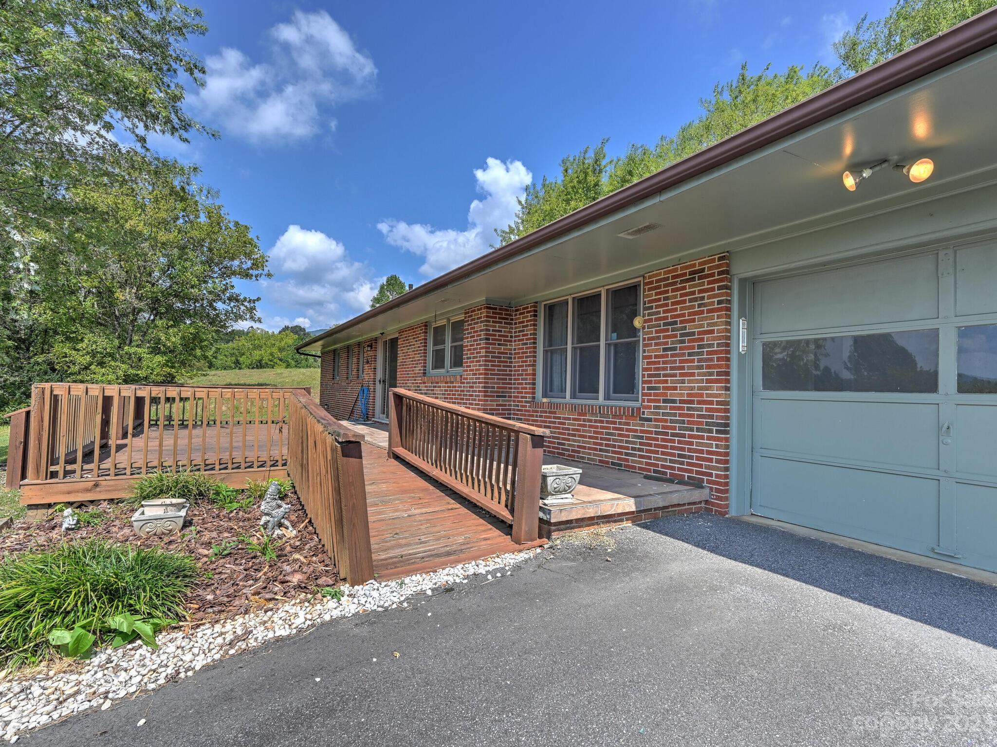146 Old Road Marshall, NC 28753 - Photo 4 of 31 a view of a house with a wooden fence