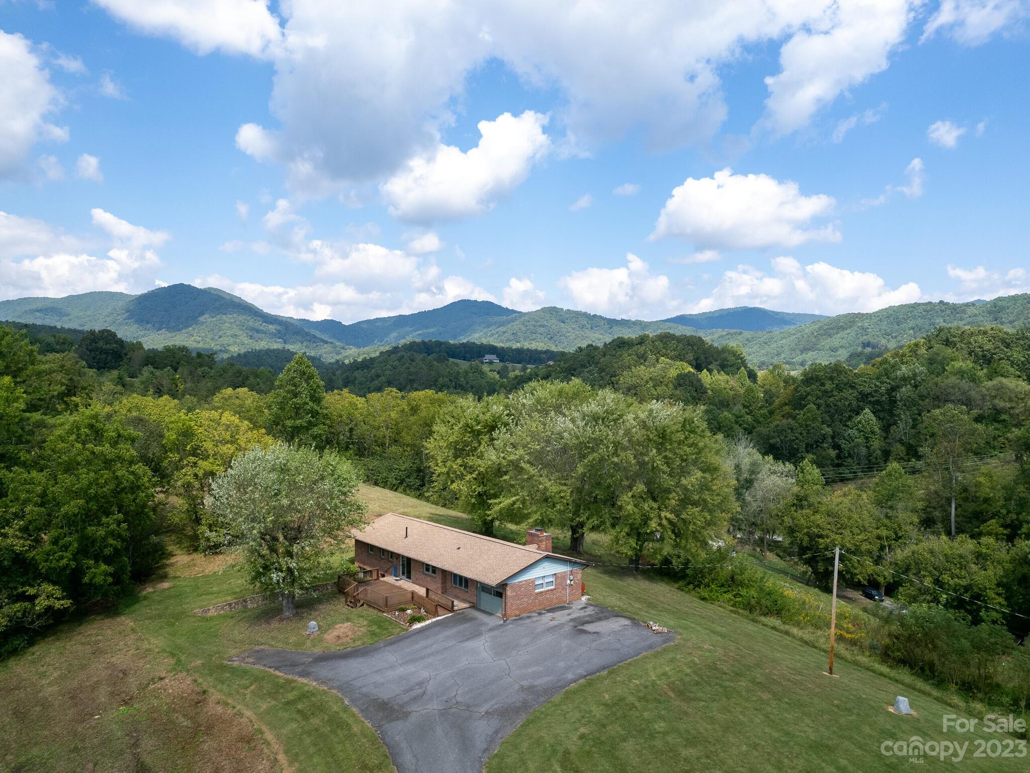 146 Old Road Marshall, NC 28753 - Photo 6 of 31 a view of a city with lush green forest