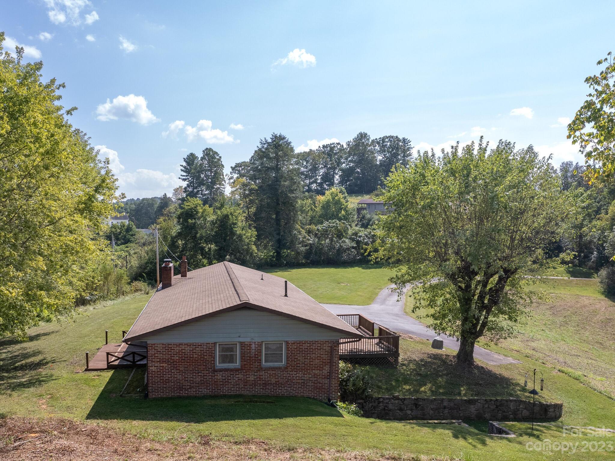 146 Old Road Marshall, NC 28753 - Photo 7 of 31 a house with trees in the background