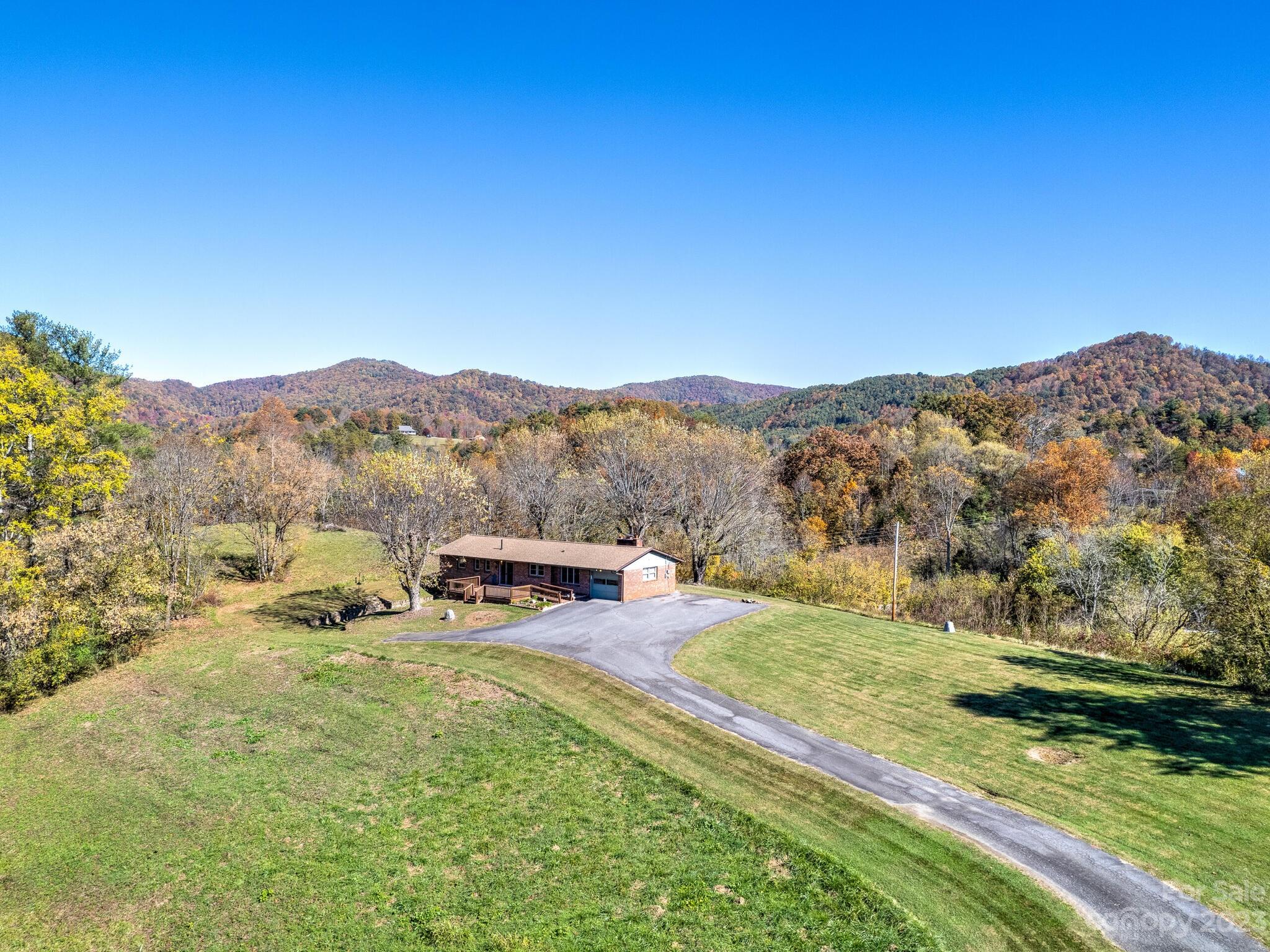 146 Old Road Marshall, NC 28753 - Photo 8 of 31 a view of a mountain with a yard