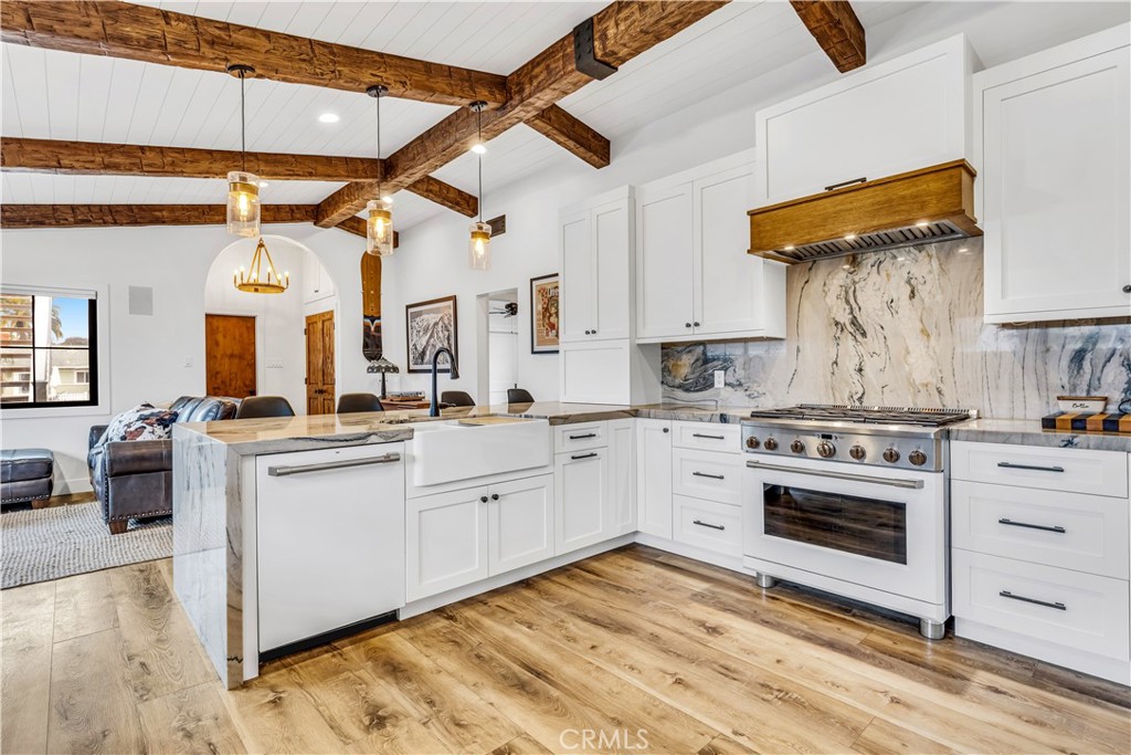 126 Avenida San Dimas San Clemente, CA 92672 - Photo 12 of 34 a kitchen with a stove cabinets and a fireplace