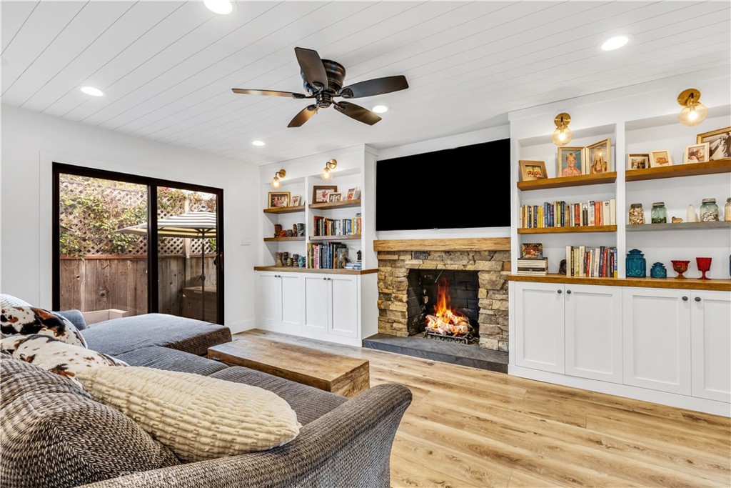 126 Avenida San Dimas San Clemente, CA 92672 - Photo 15 of 34 a living room with fireplace furniture and a flat screen tv