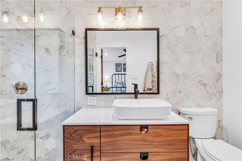 126 Avenida San Dimas San Clemente, CA 92672 - Photo 19 of 34 a bathroom with a sink a toilet and shower