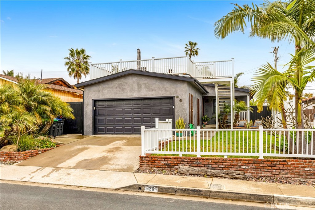 126 Avenida San Dimas San Clemente, CA 92672 - Photo 2 of 34 a front view of a house with a garden