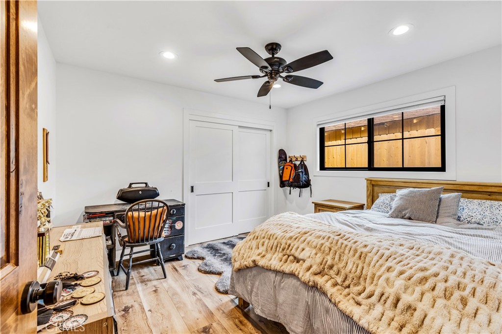 126 Avenida San Dimas San Clemente, CA 92672 - Photo 21 of 34 a bedroom with a bed and wooden floor