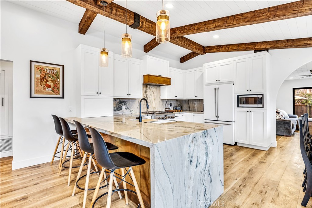 126 Avenida San Dimas San Clemente, CA 92672 - Photo 5 of 34 a open kitchen with a table and chairs in it