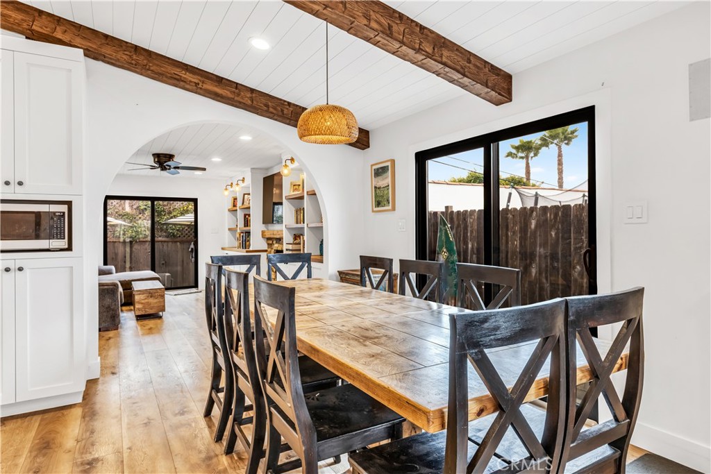126 Avenida San Dimas San Clemente, CA 92672 - Photo 9 of 34 a view of a dining room with furniture wooden floor and chandelier