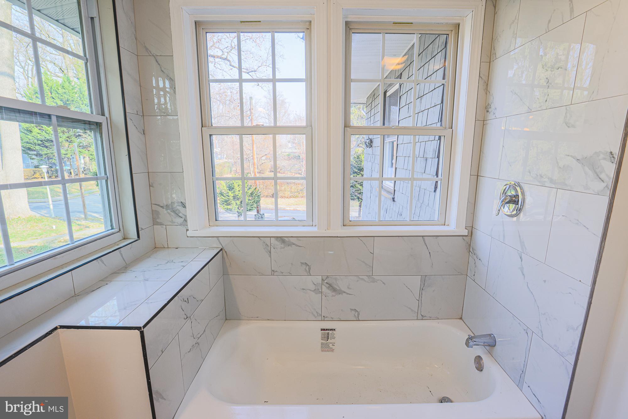 2606 Queen Anne Road Baltimore, MD 21216 - Photo 62 of 92 Bright and airy bathroom with elegant tiles.