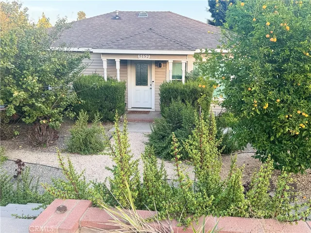 a view of a yard in front of house