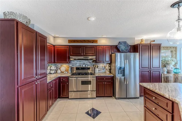 a view of a dining room with furniture wooden floor and chandelier