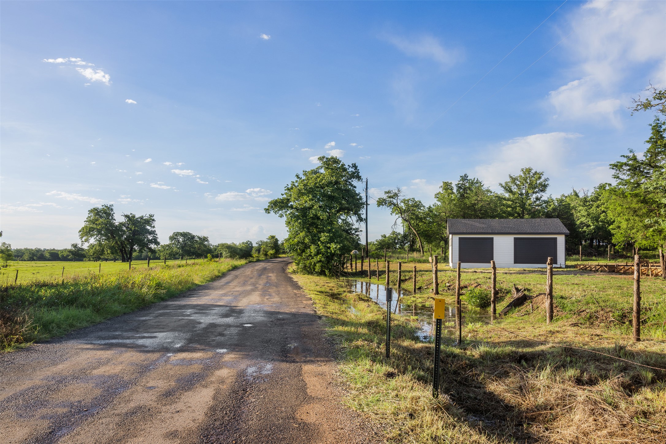 Tbd Lincoln Lake Road Paige, TX 78659 - Photo 2 of 29 a view of a house with backyard and trees