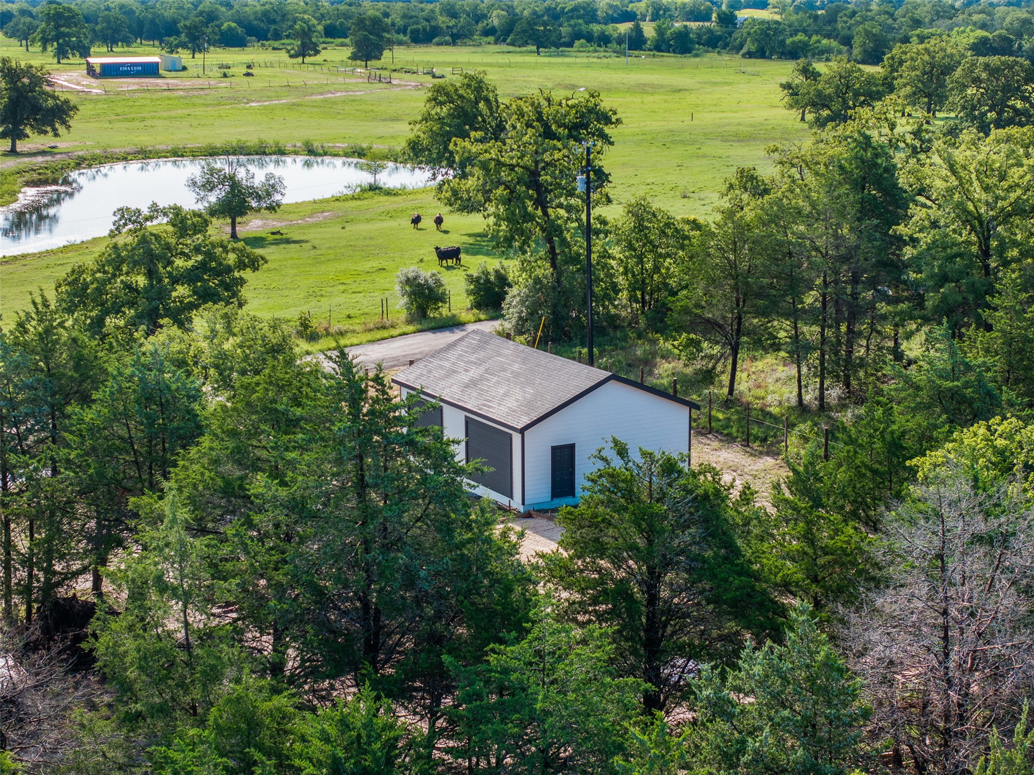 Tbd Lincoln Lake Road Paige, TX 78659 - Photo 27 of 29 a view of a lake with a house in the background