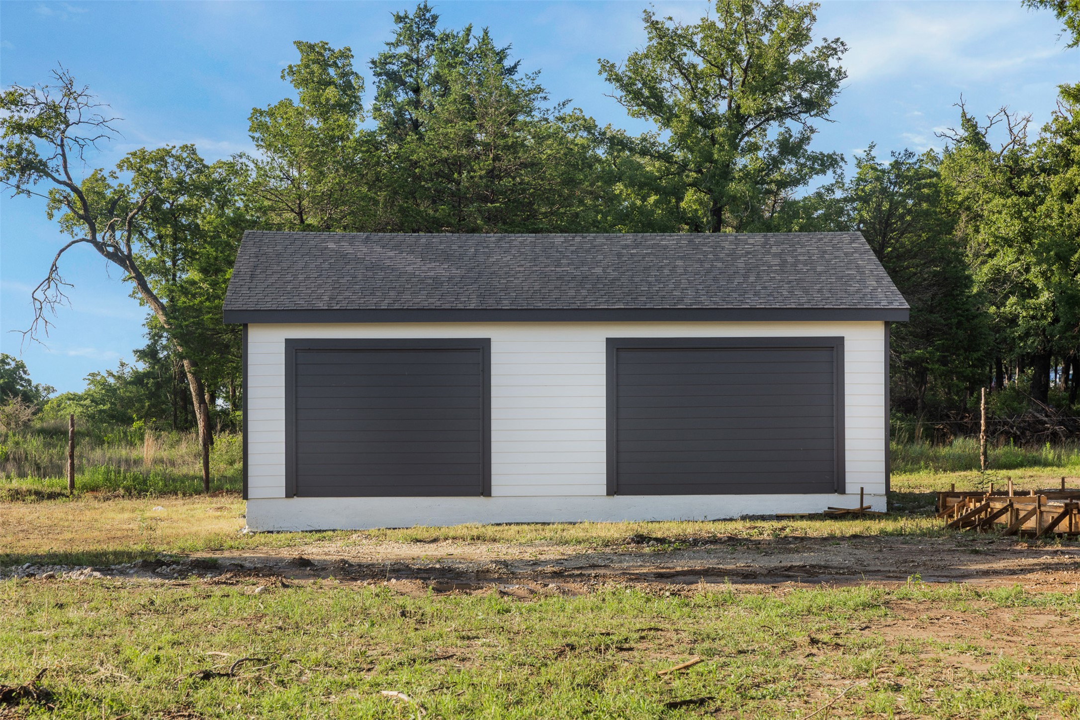 Tbd Lincoln Lake Road Paige, TX 78659 - Photo 5 of 29 a front view of a house with a garden