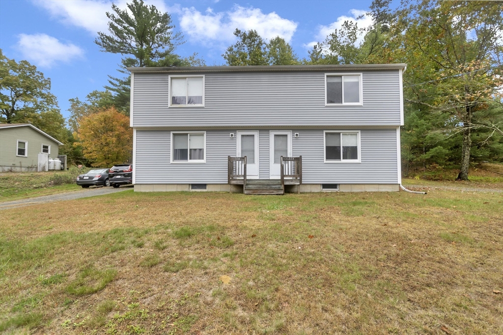55-a B Randall Road Montague, MA 01351 - Photo 1 of 33 a front view of house with yard and trees in the background
