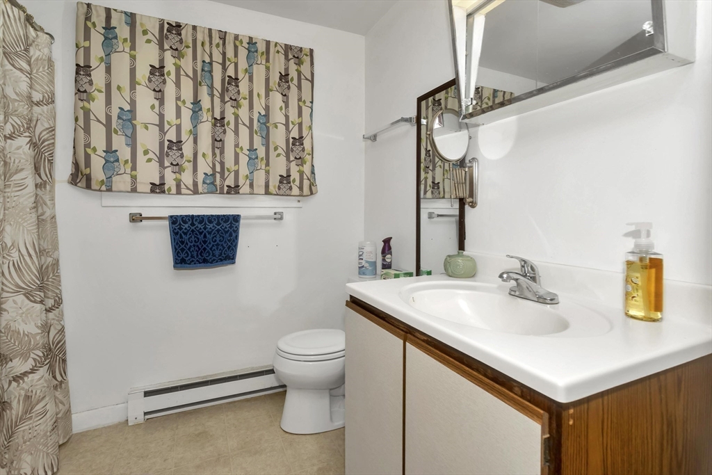 55-a B Randall Road Montague, MA 01351 - Photo 12 of 33 a bathroom with a sink a toilet and mirror
