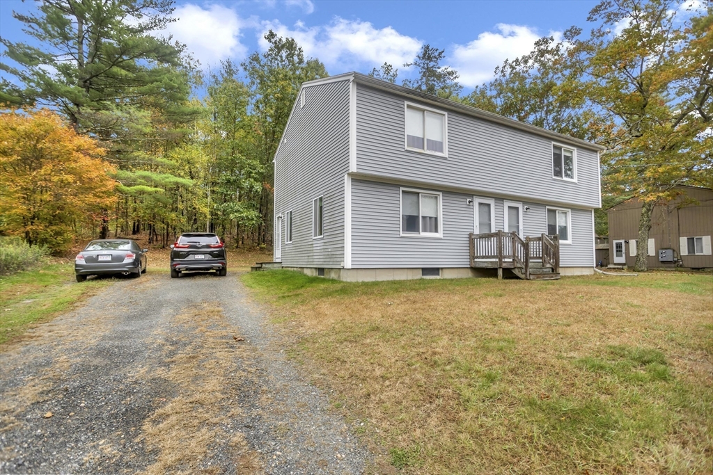 55-a B Randall Road Montague, MA 01351 - Photo 2 of 33 a front view of a house with a yard and garage