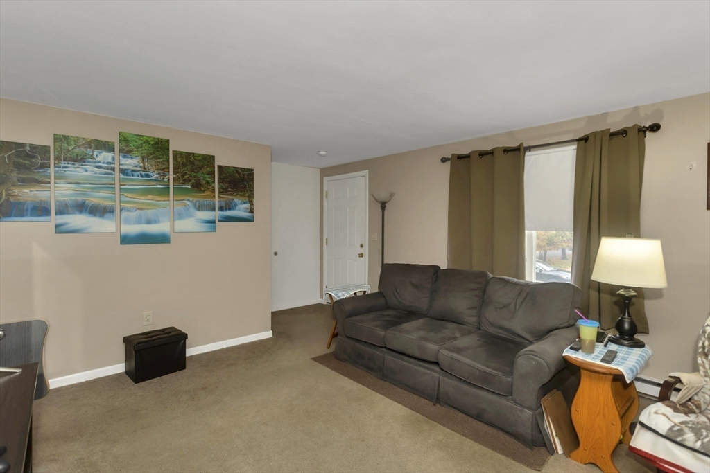 55-a B Randall Road Montague, MA 01351 - Photo 4 of 33 a living room with furniture and a window