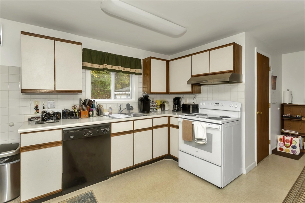 55-a B Randall Road Montague, MA 01351 - Photo 7 of 33 a kitchen with stainless steel appliances granite countertop a stove a sink and white cabinets