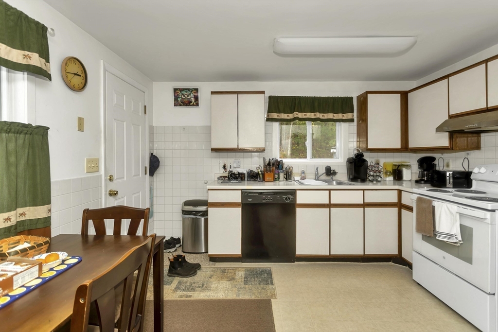 55-a B Randall Road Montague, MA 01351 - Photo 8 of 33 a kitchen with stainless steel appliances granite countertop a stove a sink and a refrigerator