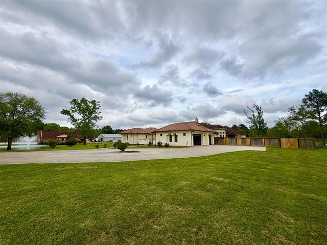 12410 Keith Road Beaumont, TX 77713 - Photo 3 of 45 a view of a house with a big yard and garden