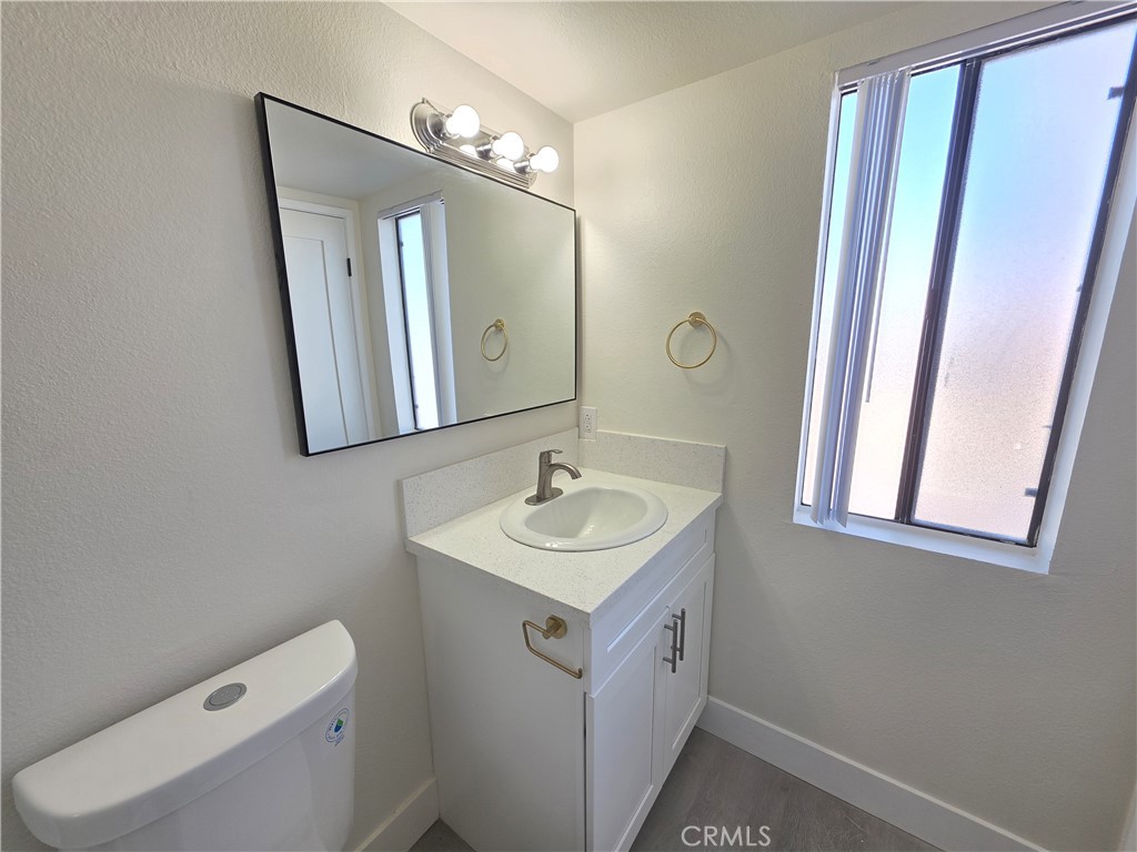 44155 10th Lancaster, CA 93534 - Photo 11 of 14 a bathroom with a sink and a mirror