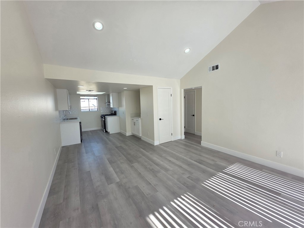 44155 10th Lancaster, CA 93534 - Photo 4 of 14 a view of empty room with wooden floor