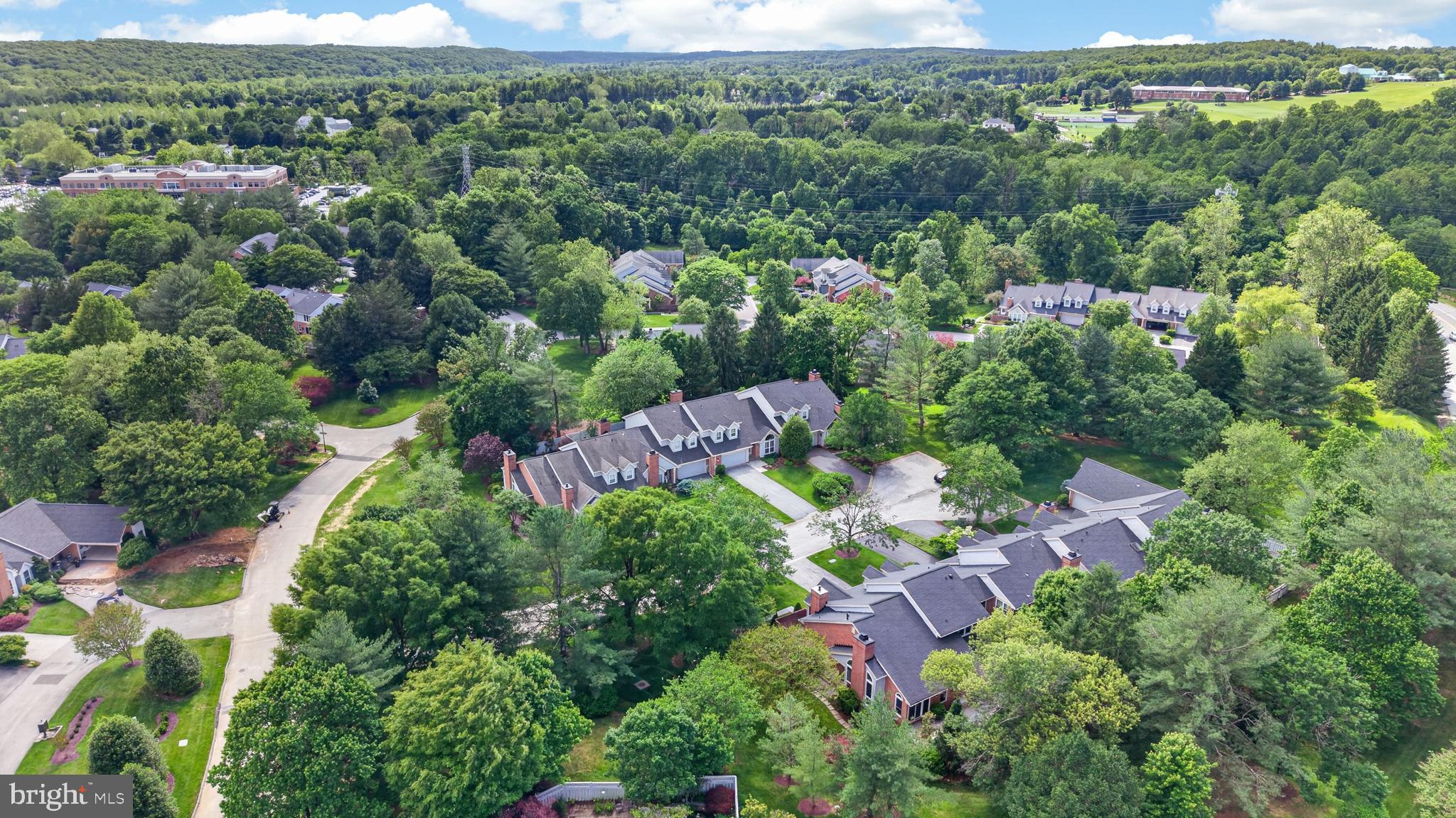 6 Nearfield Road Lutherville-Timonium, MD 21093 - Photo 2 of 71 an aerial view of a city with lots of residential buildings and mountain view in back
