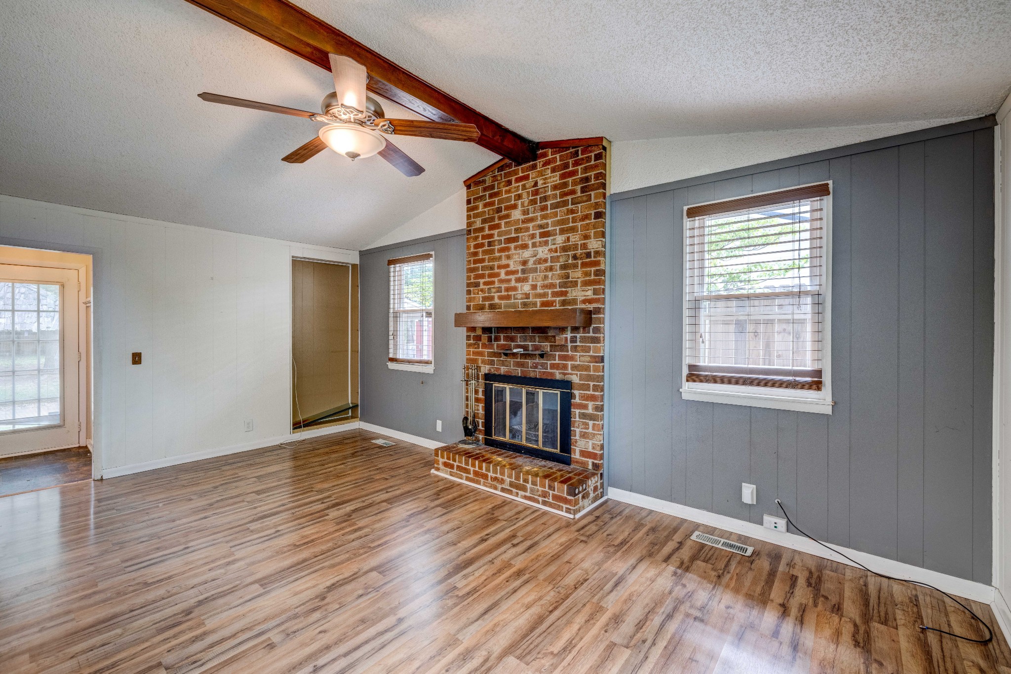 3312 Country Way Road Antioch, TN 37013 - Photo 15 of 35 a view of an empty room with wooden floor fireplace and a window