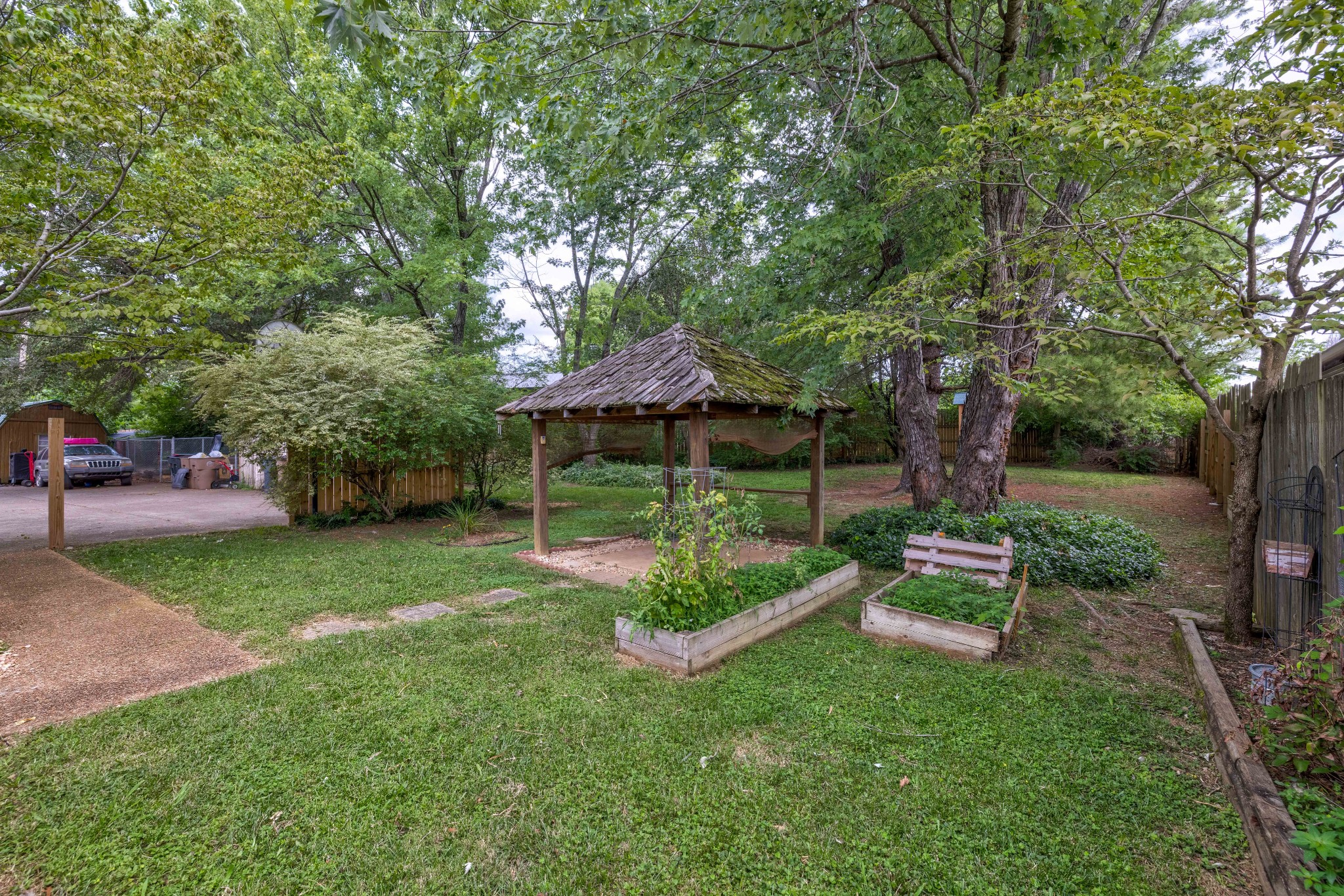 3312 Country Way Road Antioch, TN 37013 - Photo 32 of 35 a view of table and chairs under an umbrella