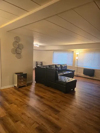 a view of kitchen with wooden floor