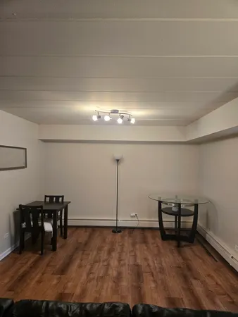a view of a livingroom with chairs