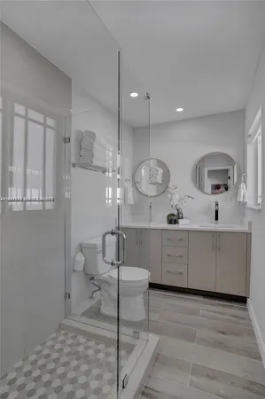 a view of a bathroom sink and mirror